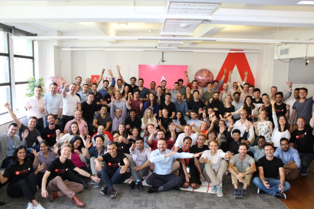 A snapshot of various Antler-backed startups working in a co-working space, showcasing teams brainstorming, coding, and preparing for investor meetings.