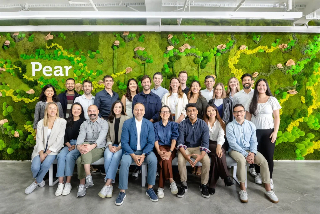 get into PearX accelerator team photo showing founders and mentors together under Pear sign