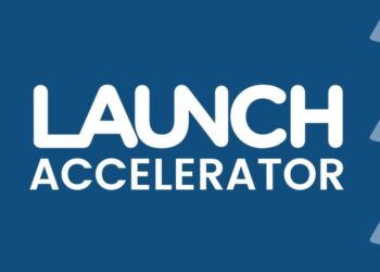 An image showing a group of startup founders collaborating in a modern workspace, with the LAUNCH Accelerator logo displayed in the background. The scene captures an energetic and innovative environment, representing the accelerator's focus on funding, mentorship, and growth for early-stage startups.