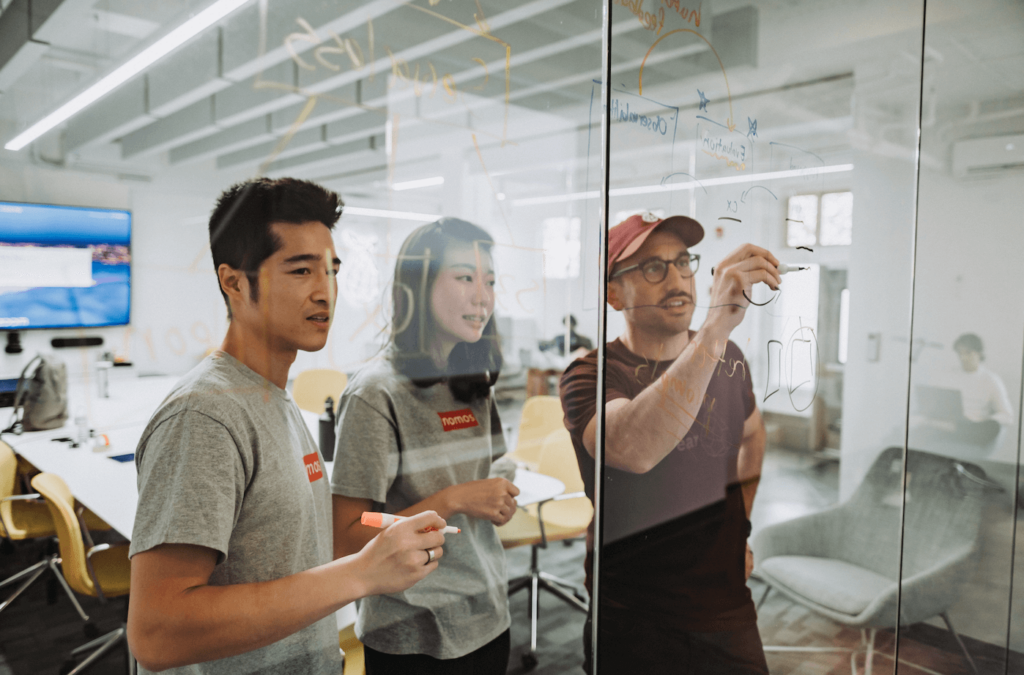 get into PearX accelerator session with founders collaborating and mapping ideas on a glass board