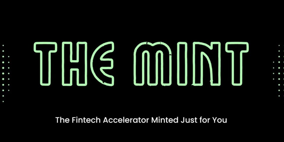 A professional workspace with fintech founders collaborating, discussing strategies, and reviewing financial data on laptops. The The Mint Accelerator logo is prominently displayed, representing BTV’s fintech-focused pre-seed program.