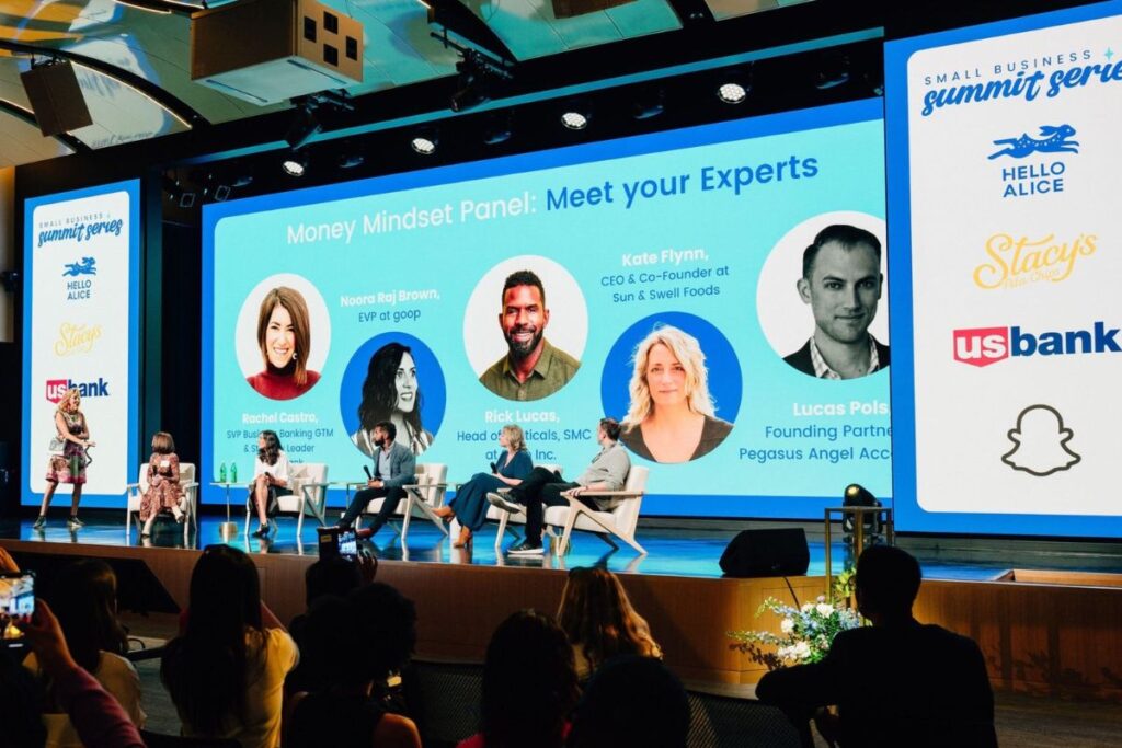 Image of startup founders pitching their companies on stage during Pegasus Angel Accelerator’s Demo Day, with investors seated in the audience.