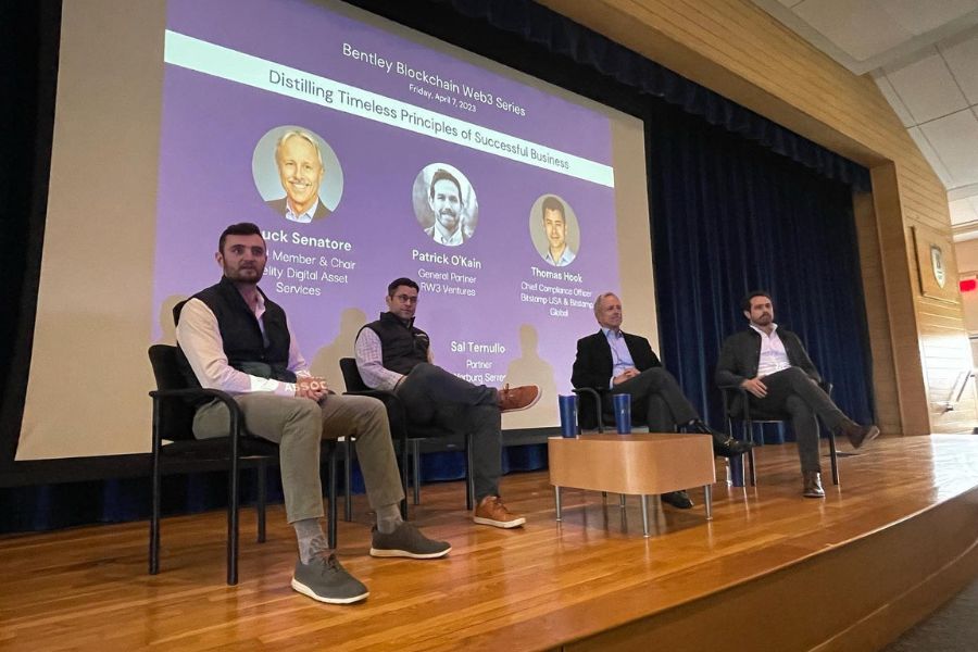 A vibrant event setting where startup founders present their pitches to investors and industry leaders at QUBIC Labs’ Demo Day.