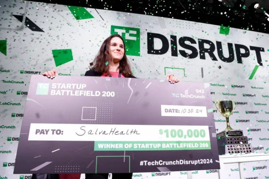 A startup founder giving a live product demo to judges during the TechCrunch Startup Battlefield competition.