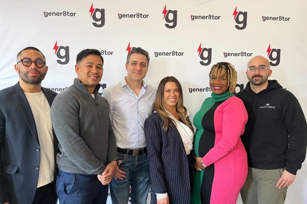 A group of gBETA startup founders gathered during a pitch event, networking and sharing ideas.