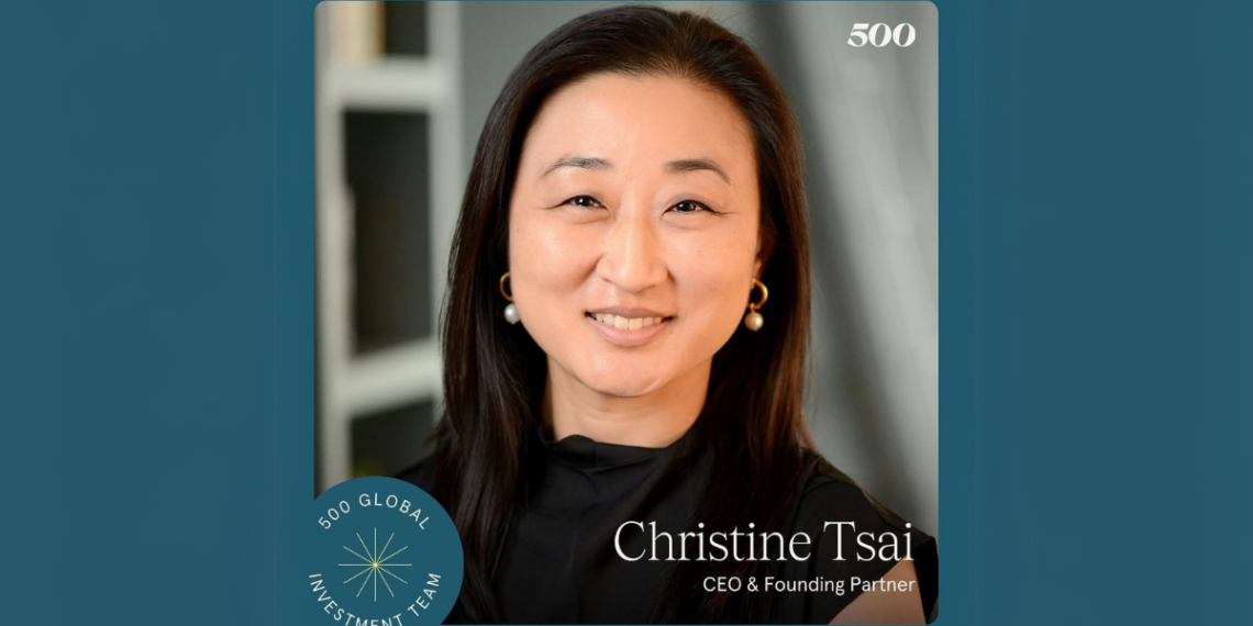 Christine Tsai standing confidently in front of a backdrop with 500 Global branding.