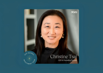 Christine Tsai standing confidently in front of a backdrop with 500 Global branding.