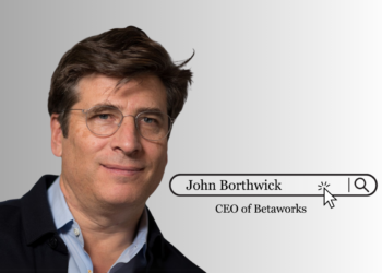 John Borthwick, CEO of Betaworks, standing in a modern workspace environment, representing the face of the Betaworks startup studio.