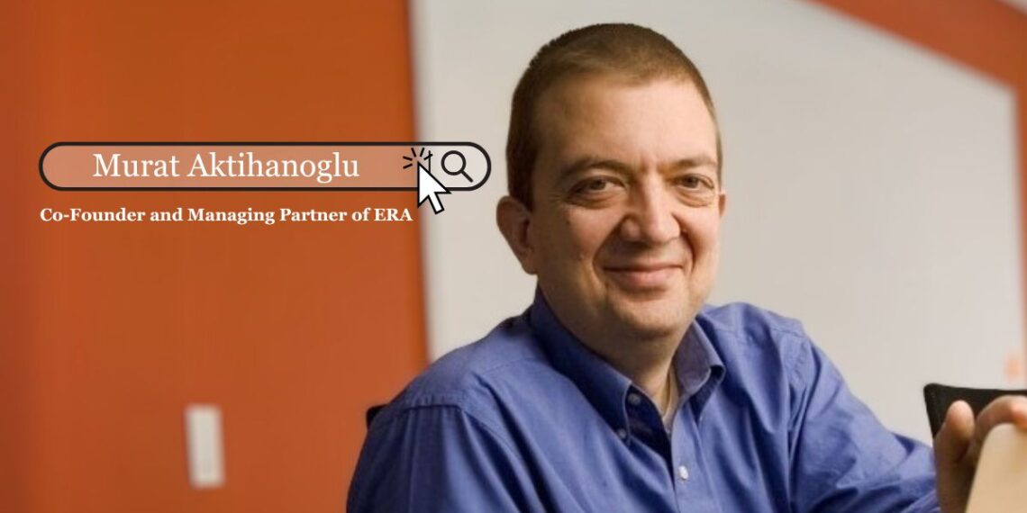 Murat Aktihanoglu standing in front of a city skyline, representing his role as Co-Founder and Managing Partner of Entrepreneurs Roundtable Accelerator (ERA).