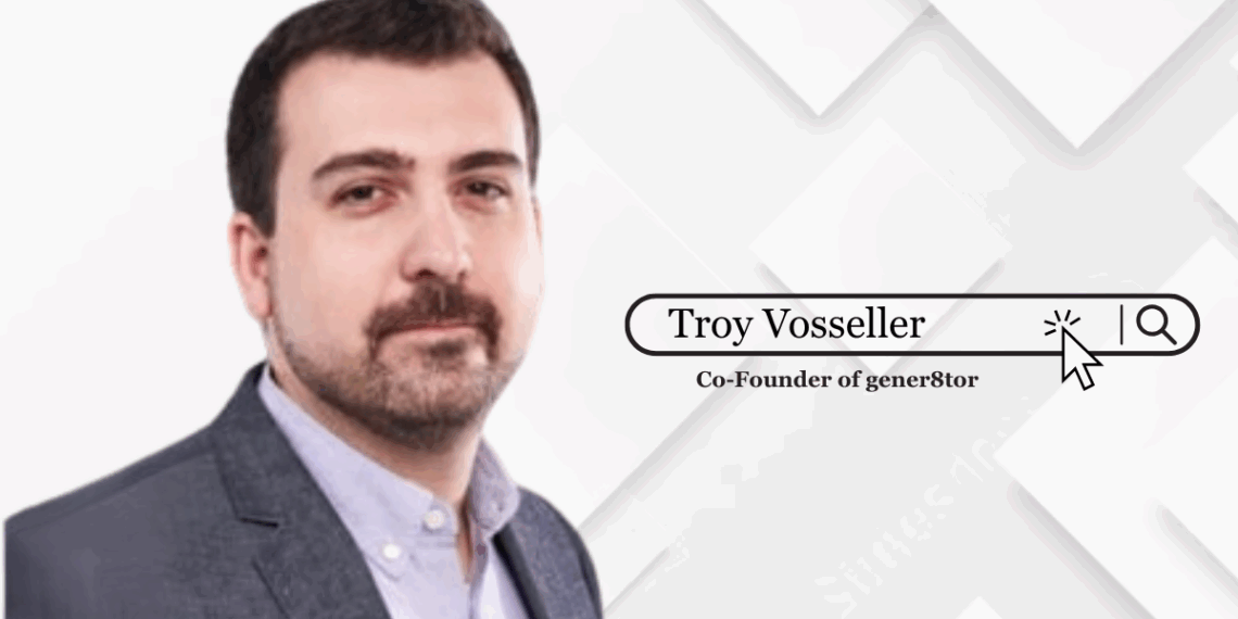 Troy Vosseller standing confidently in front of a gener8tor-branded backdrop, symbolizing leadership and startup mentorship.