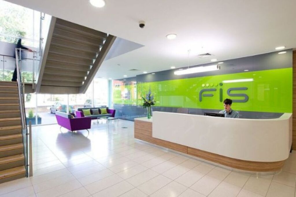 Modern office space used by the FIS Fintech Accelerator, featuring workstations and branding elements.