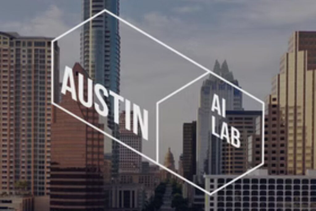 Interior view of the International Accelerator’s AI Lab in Austin, showing modern workstations and founders working on tech projects.