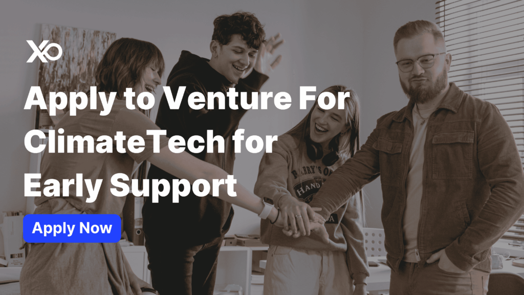 Founders celebrating teamwork during a ClimateTech accelerator meeting