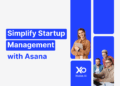 Startup founders using laptops and tablets, representing Asana’s project management tool for startups via XRaise.