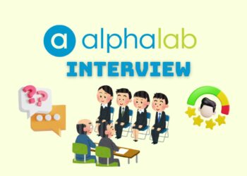 Minimalist illustration representing a founder preparing for a AlphaLab Accelerator Interview — laptops open, notes on the desk, focused atmosphere.