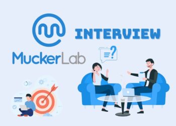 Minimalist illustration representing a founder preparing for a MuckerLab Accelerator Interview , laptops open, notes on the desk, focused atmosphere.