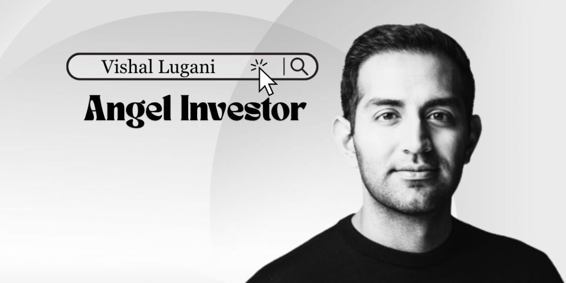 Smiling Vishal Lugani in a blazer, New York skyline backdrop.