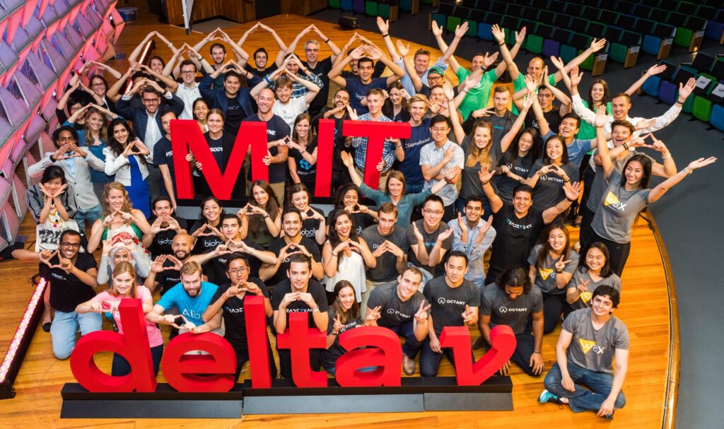Demo Day highlights from the MIT delta v Accelerator, showing startups pitching their innovative ideas to investors and an attentive audience.