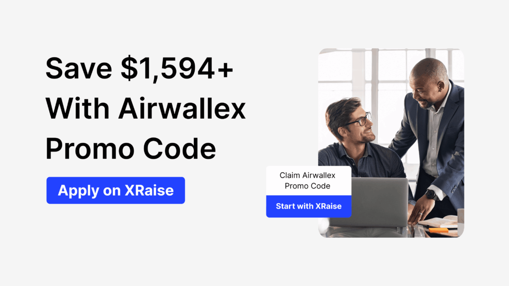 Two colleagues working at a laptop discussing how to save money using an Airwallex promo code offer