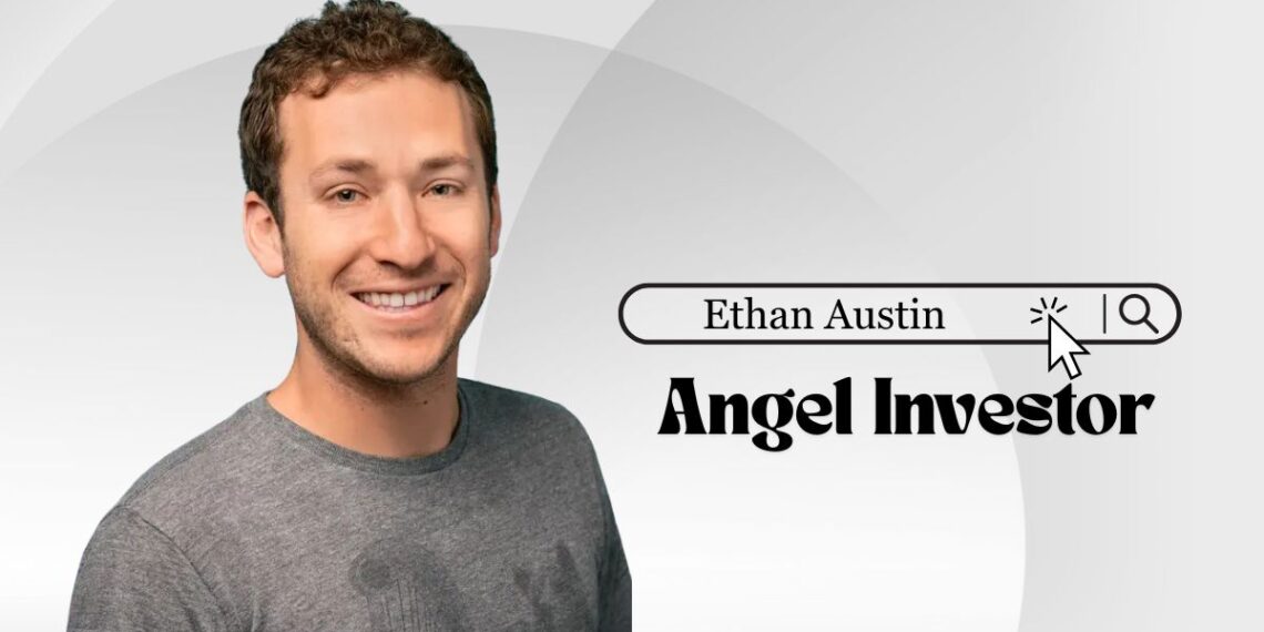 Headshot of Ethan Austin outdoors, smiling in front of ocean backdrop.