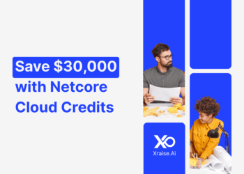 Startup founders discussing marketing plans with banner text “Save $30,000 with Netcore Cloud Credits” via XRaise.ai.
