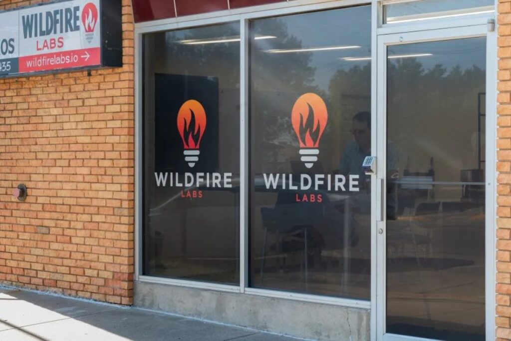 Wildfire Labs office or workspace image depicting a modern, open-concept environment filled with creative workstations, meeting zones, and technology inspiring productivity and collaboration. 