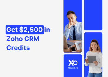 Founders using tablets with banner text “Get $2500 in Zoho CRM Credits” via XRaise.ai, promoting startup CRM perks.