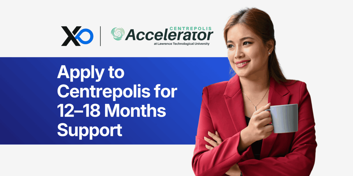 Smiling woman in a red blazer holding a coffee mug beside a banner inviting founders to apply to the Centrepolis Accelerator for 12–18 months of support.