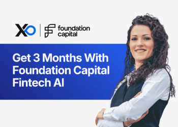 Confident woman in business attire standing beside a banner promoting three months with Foundation Capital’s Fintech AI accelerator program.