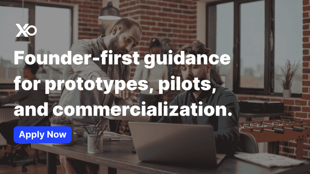 Founders collaborating on hardware prototypes at a workspace — Apply to Centrepolis Accelerator