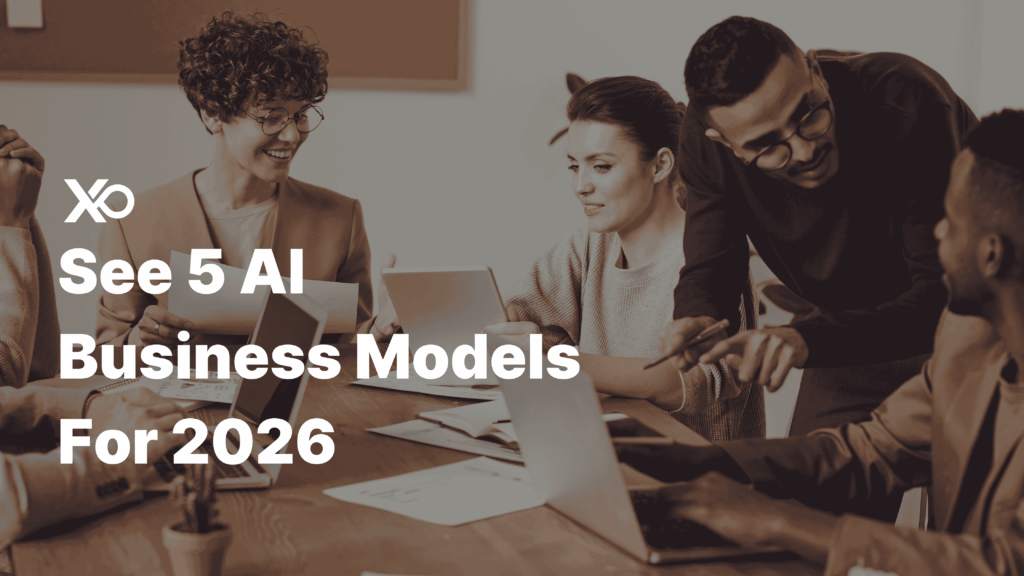 Team planning how to start an AI business in 2026 around laptops