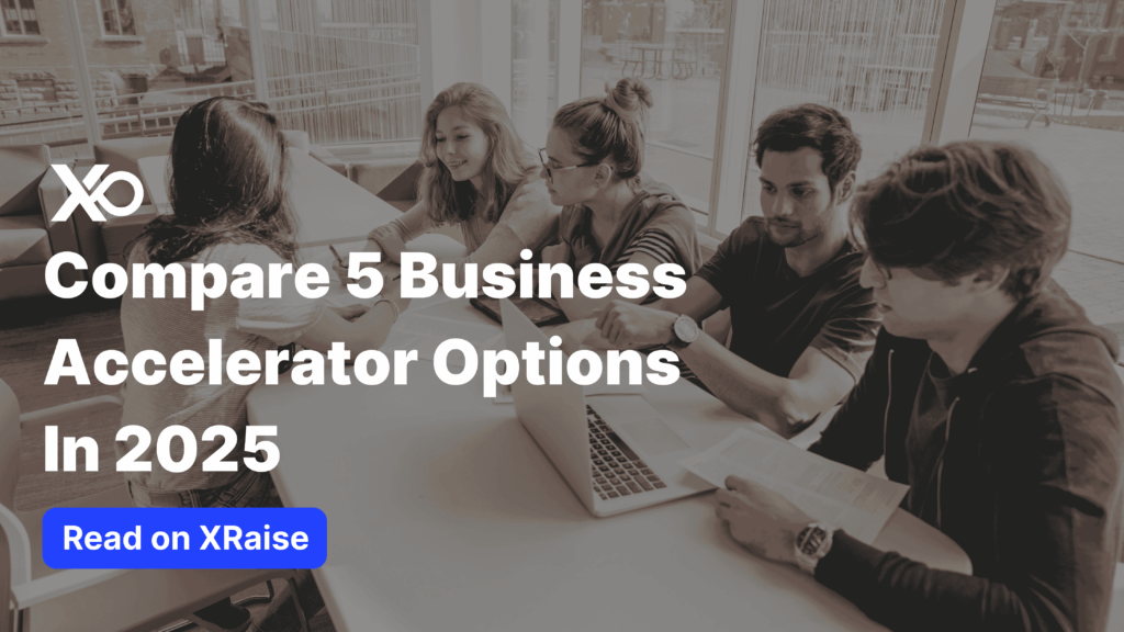 Group of five young professionals sitting around a table with laptops and papers, overlaid with large white text that reads “Compare 5 Business Accelerator Options In 2025” and a blue “Read on XRaise” button at the bottom.