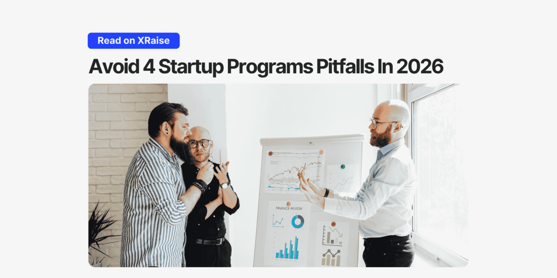 Team reviewing charts on a whiteboard while discussing startup programs pitfalls