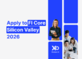 Apply to FI Core Silicon Valley 2026 accelerator – smiling founder holding a tablet next to a startup team working together on a laptop
