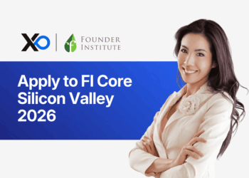 Smiling woman in a cream blazer stands with arms crossed beside a banner inviting founders to apply to the FI Core Silicon Valley 2026 accelerator.