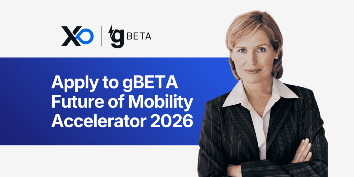 Confident woman in a pinstripe suit stands with folded arms beside a banner inviting founders to apply to the gBETA Future of Mobility Accelerator 2026.