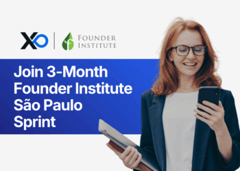 Smiling woman in a blazer holding a tablet and looking at her phone beside text inviting founders to join a 3-month Founder Institute São Paulo sprint.