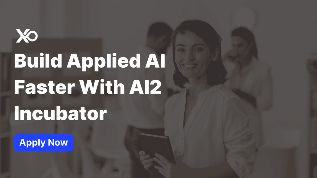 Apply to AI2 Incubator promotional banner showing a smiling woman founder holding a notebook in a modern office with text that reads “Build Applied AI Faster With AI2 Incubator.”