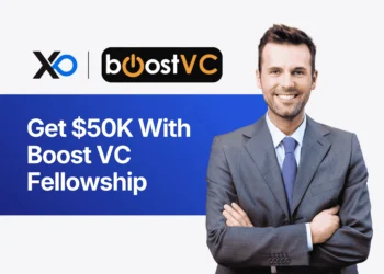 Apply to Boost VC Fellowship banner showing a smiling founder in a suit beside text about getting $50K through the program.