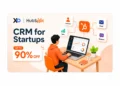 Centered HubSpot CRM banner with founder at laptop, 90% off card, and connected sales icons