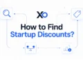 XRaise hero graphic with search, tag, balance, and savings icons around startup discounts headline
