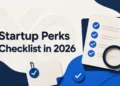 XRaise hero image showing a startup perks checklist with checkmarks, magnifying glass, and blue abstract shapes